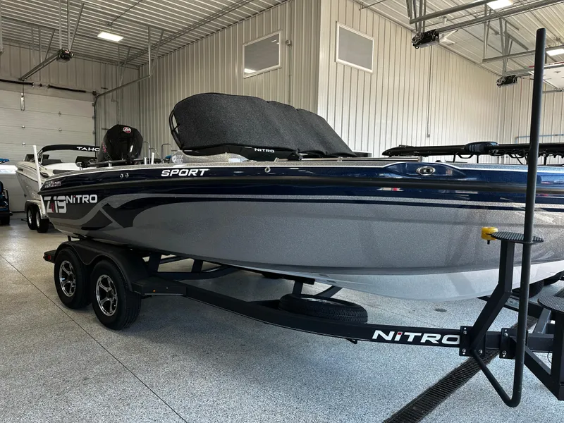 Slide: The Image of 2024 Nitro ZV19 Sport boat in a showroom. - 10