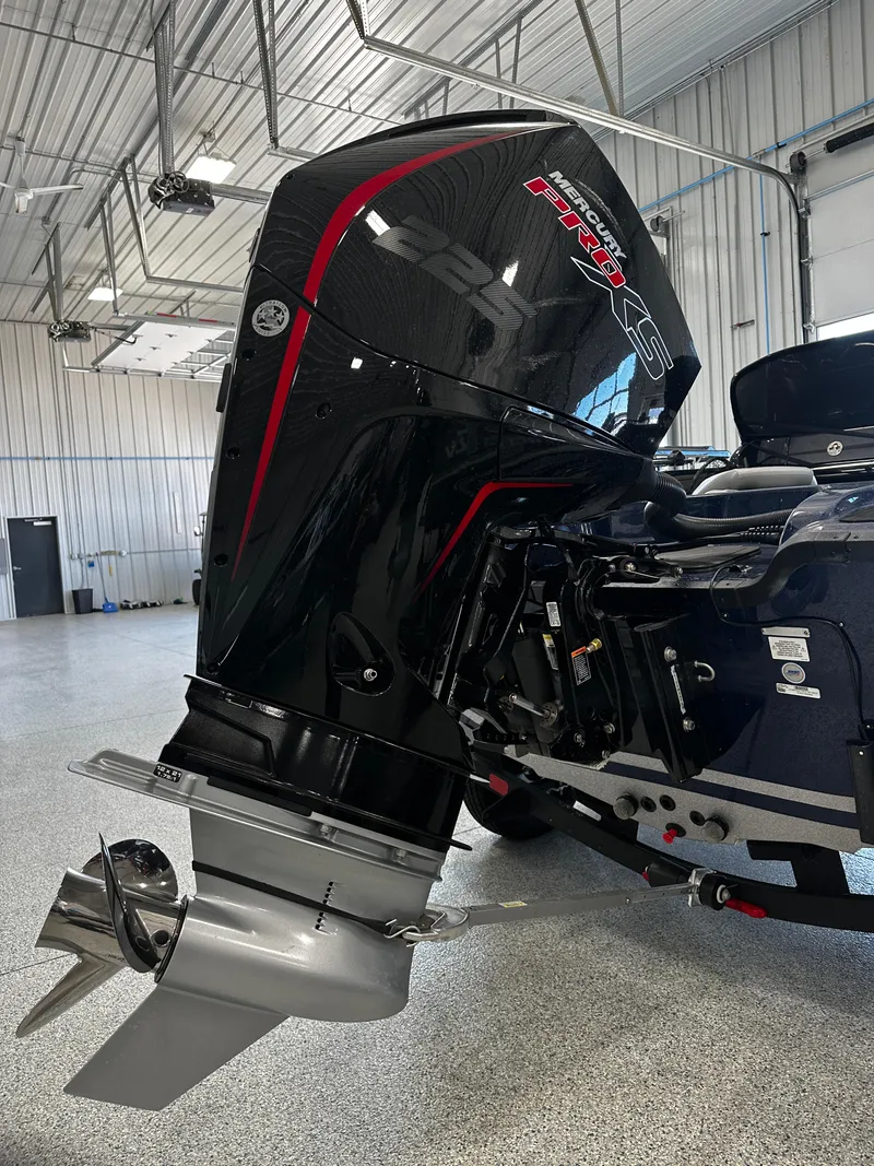 Slide: The Image of 2024 Nitro ZV19 Sport outboard motor in a garage. - 4