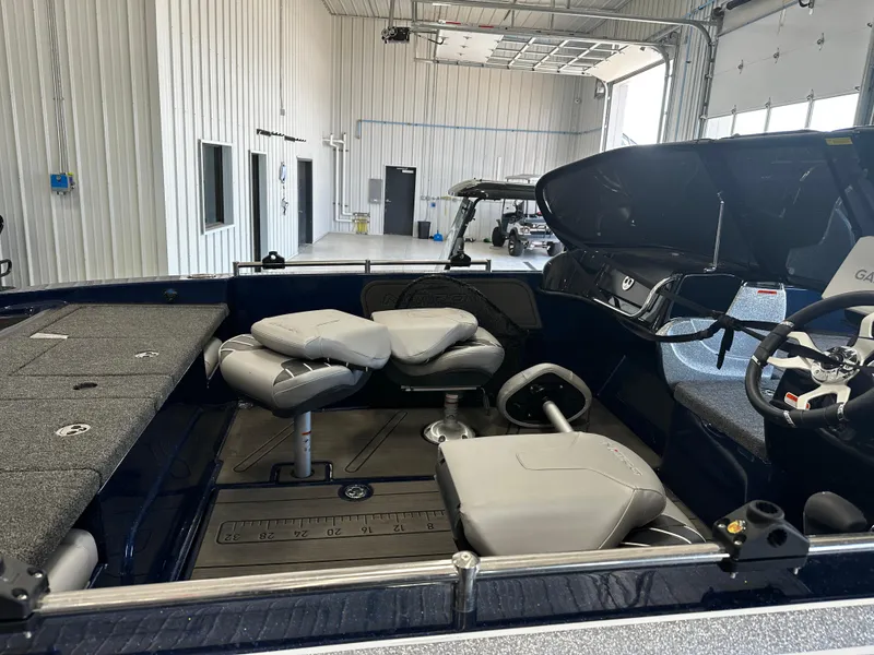 Slide: The Image of 2024 Nitro ZV19 Sport boat interior in a showroom. - 6