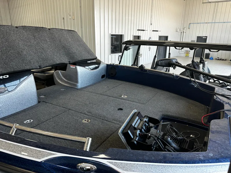 Slide: The Image of 2024 Nitro ZV19 Sport boat interior with spacious deck and advanced fishing equipment. - 8