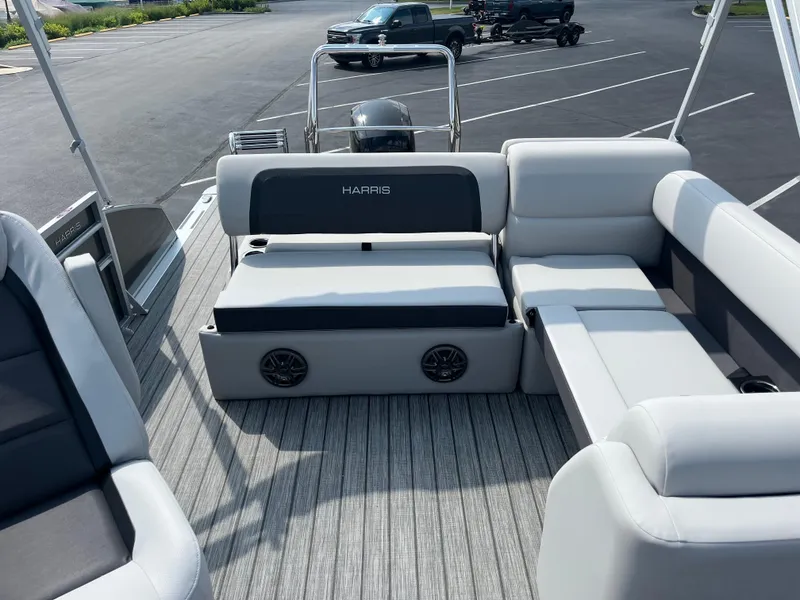 Slide: The Image of 2025 Harris Cruiser 210 pontoon boat with spacious seating and modern design. - 7