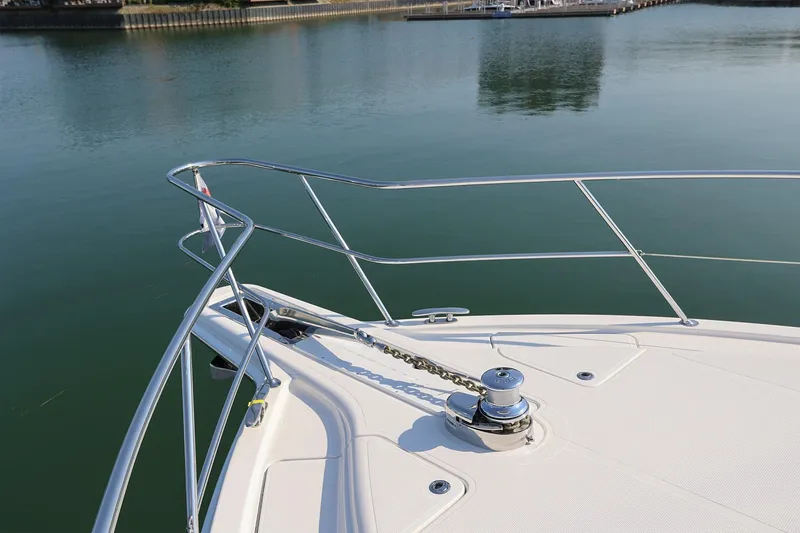 Slide: The Image of Bow of 2016 Riviera 525 SUV yacht on calm water. - 33