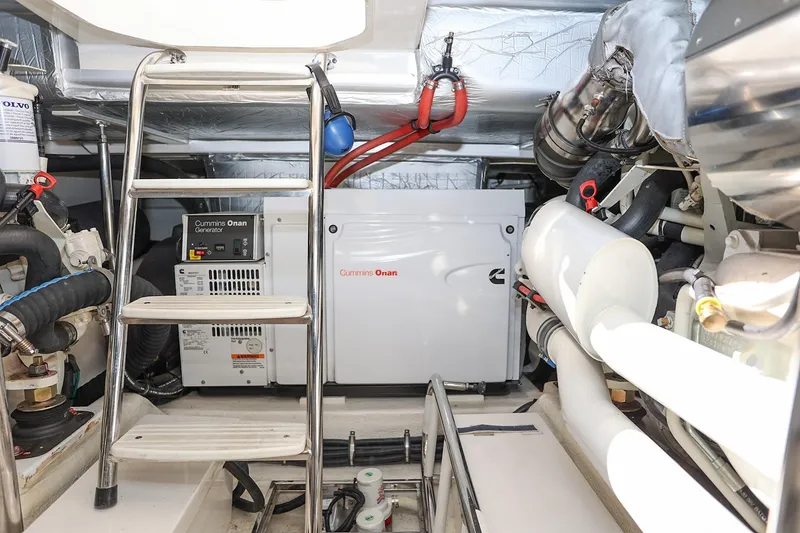 Slide: The Image of Engine room of 2016 Riviera 525 SUV with Cummins Onan generator and ladder access. - 44