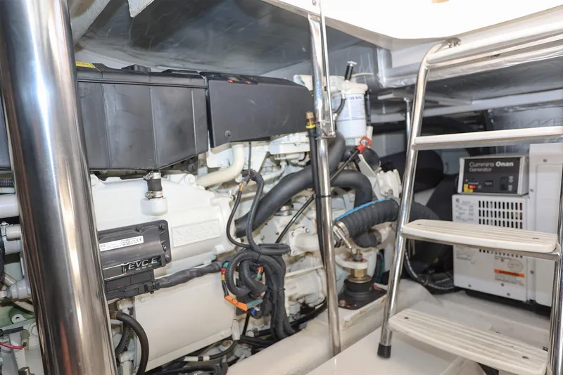 Slide: The Image of Engine room of 2016 Riviera 525 SUV with visible machinery and ladder. - 45