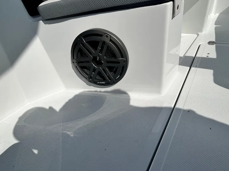 Slide: The Image of 2024 Scarab 255 Open ID boat interior with speaker and seating. - 10