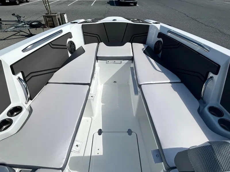 Slide: The Image of 2024 Scarab 255 Open ID boat interior with cushioned seating and cup holders. - 11