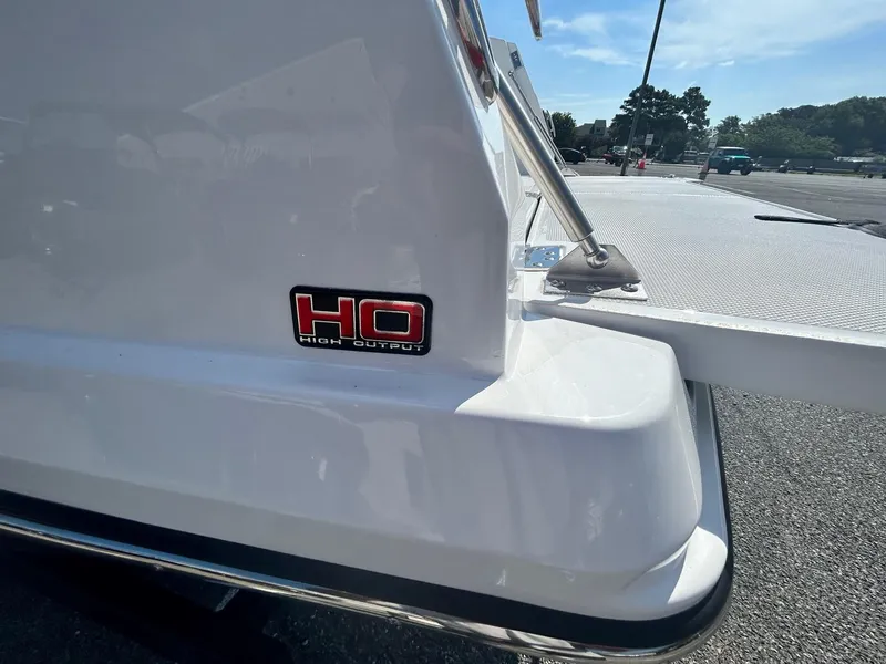 Slide: The Image of 2024 Scarab 255 Open ID boat rear view with HO High Output badge. - 12