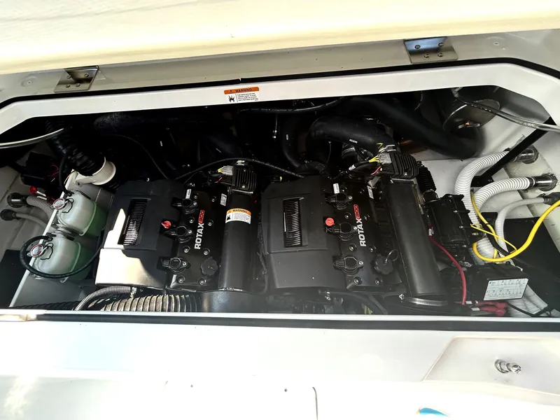 Slide: The Image of Engine compartment of 2024 Scarab 255 Open ID boat showing dual Rotax engines. - 18