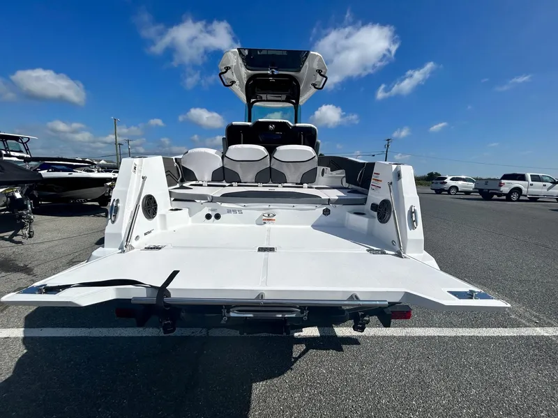 Slide: The Image of 2024 Scarab 255 Open ID boat rear view on a sunny day. - 23
