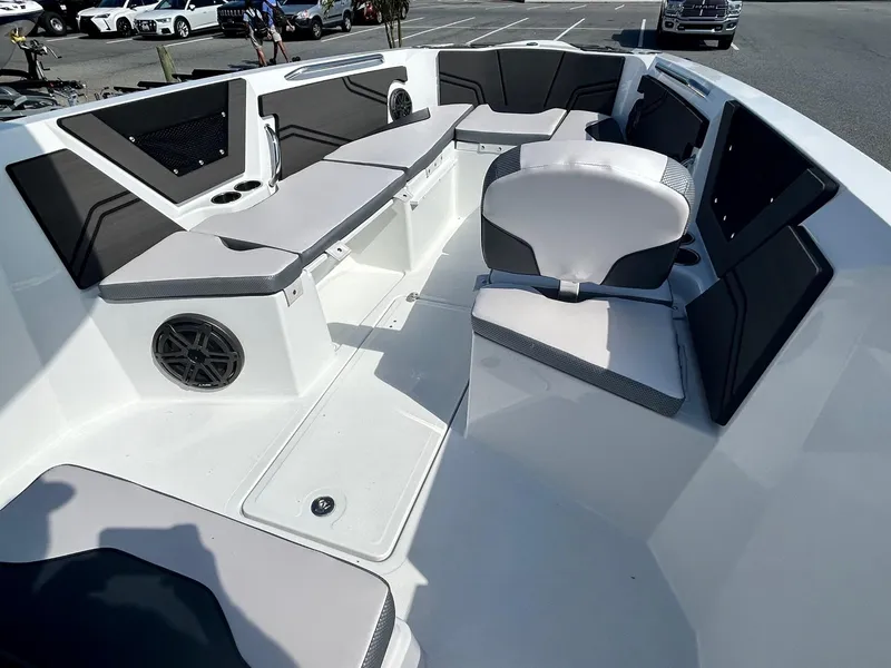 Slide: The Image of 2024 Scarab 255 Open ID boat interior with seating and speakers. - 9