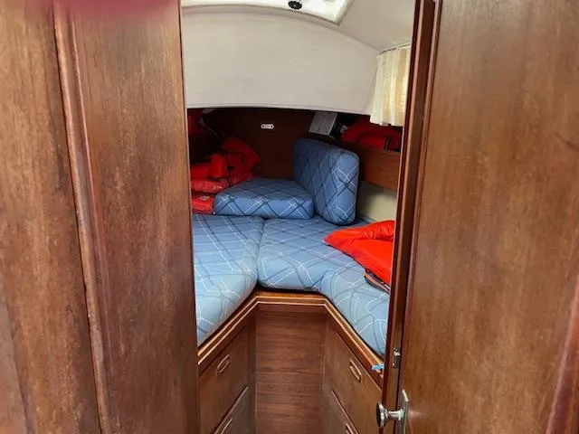 Slide: The Image of Cozy cabin interior of 1982 Sabre 30 MK I sailboat with blue cushions. - 10