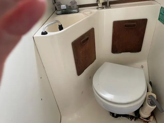 Slide: The Image of 1982 Sabre 30 MK I boat bathroom with toilet and sink. - 12