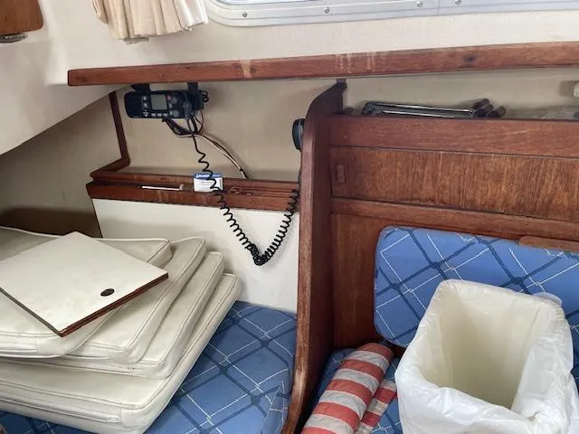Slide: The Image of Interior of 1982 Sabre 30 MK I sailboat with blue cushions and wooden cabinetry. - 15