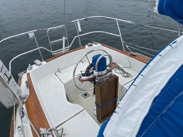 Slide: The Image of Cockpit of 1982 Sabre 30 MK I sailboat with wooden accents and steering wheel. - 3