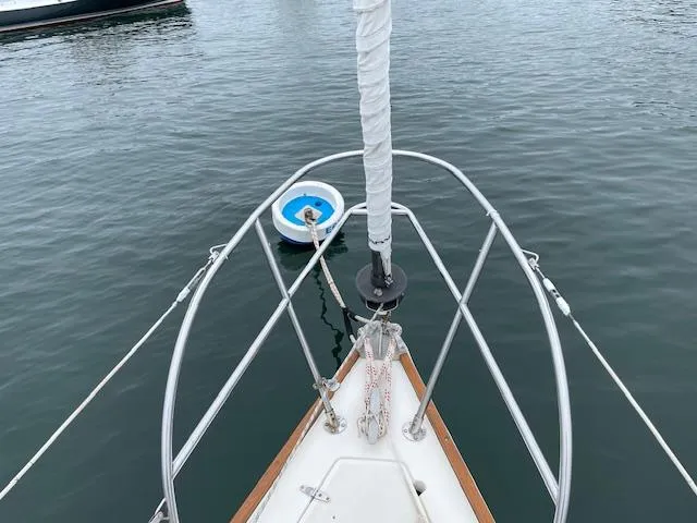 Slide: The Image of Bow of 1982 Sabre 30 MK I sailboat with mooring buoy in calm water. - 5