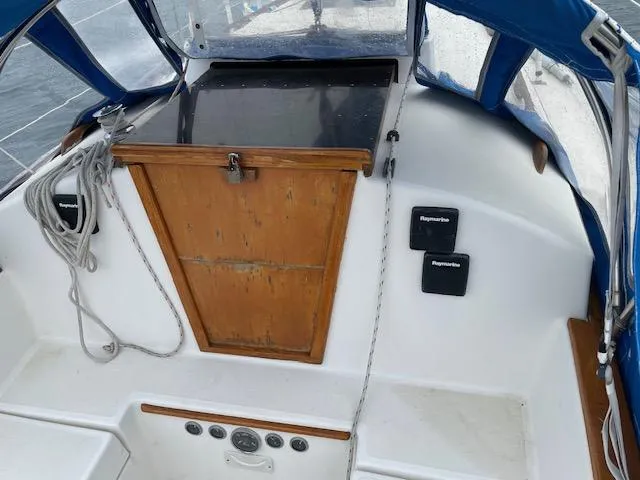 Slide: The Image of Cockpit of 1982 Sabre 30 MK I sailboat with wooden hatch and blue canopy. - 7