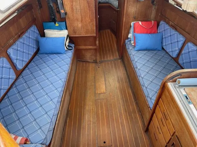 Slide: The Image of Interior of 1982 Sabre 30 MK I sailboat with blue plaid cushions and wooden finish. - 8