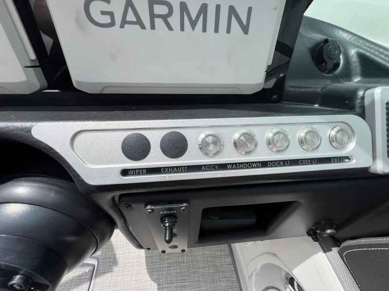 Slide: The Image of Control panel of 2024 Crownline 250 XSS boat with Garmin navigation system. - 14