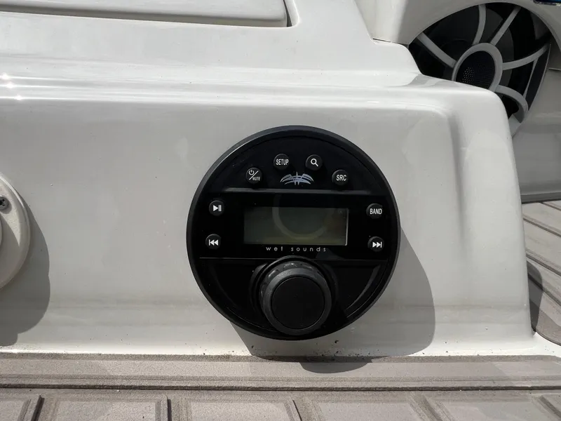Slide: The Image of 2024 Crownline 250 XSS boat audio control panel with Wet Sounds system. - 20