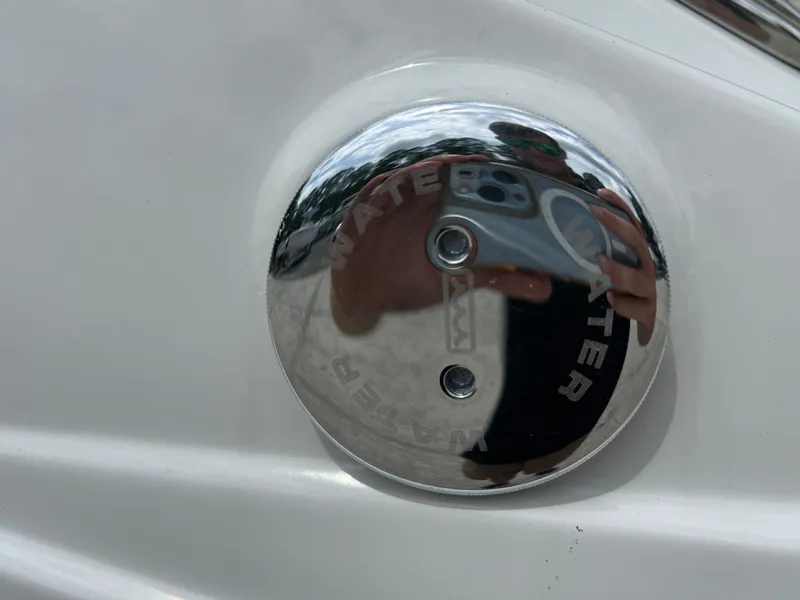 Slide: The Image of Close-up of 2024 Crownline 250 XSS water inlet cap. - 25