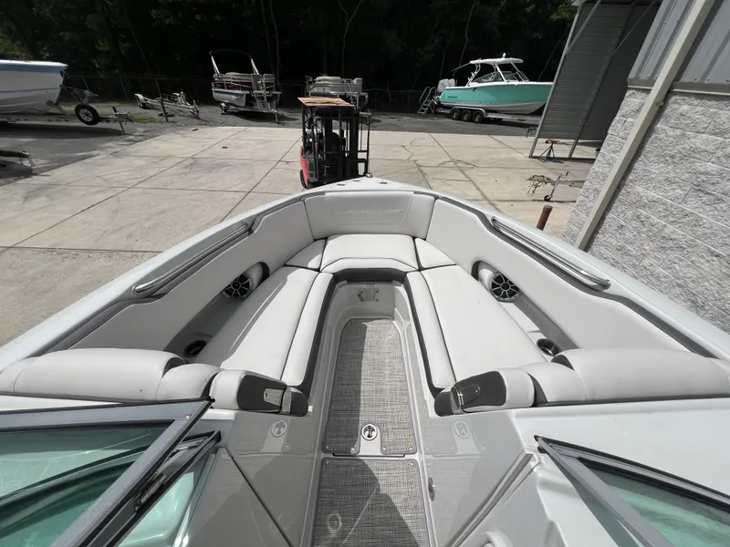 Slide: The Image of 2024 Crownline 250 XSS boat with spacious bow seating area. - 4