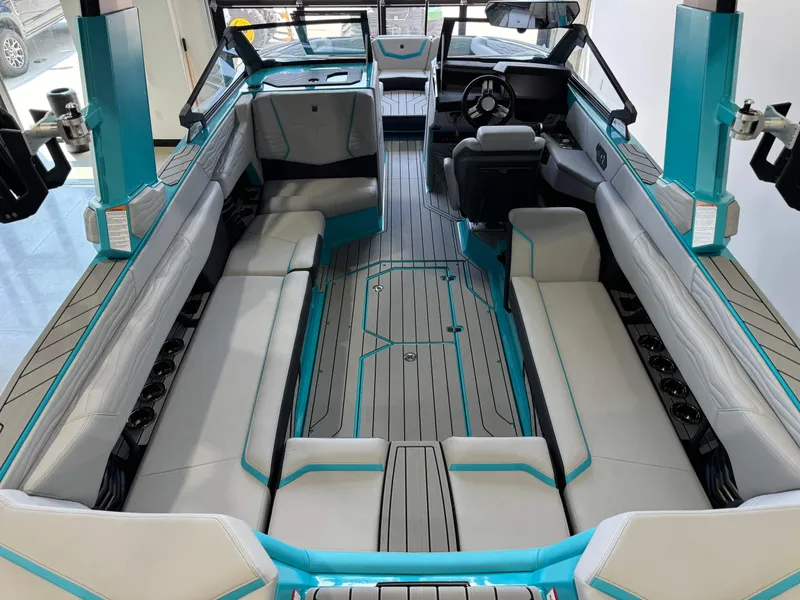 Slide: The Image of 2025 Nautique Super Air Nautique G25 interior with spacious seating and modern design. - 13