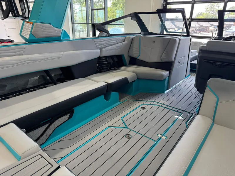 Slide: The Image of 2025 Nautique Super Air Nautique G25 interior, featuring modern seating and sleek design. - 14