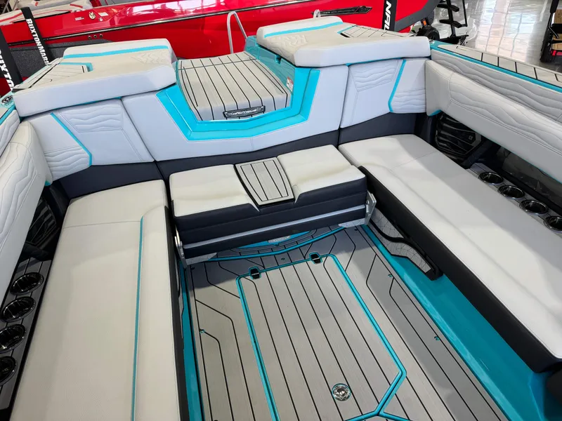 Slide: The Image of Interior of 2025 Nautique Super Air Nautique G25 boat with gray and blue seating. - 16