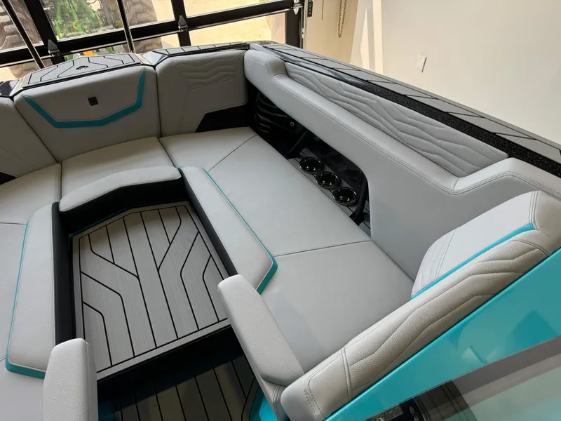 Slide: The Image of Interior seating of 2025 Nautique Super Air Nautique G25 boat with modern design. - 18