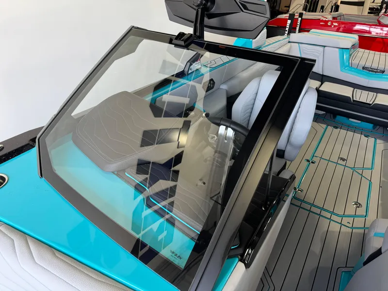 Slide: The Image of Interior of 2025 Nautique Super Air Nautique G25 boat with modern seating and dashboard. - 20