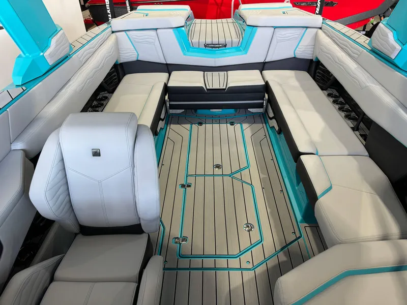 Slide: The Image of Interior of 2025 Nautique Super Air Nautique G25 boat with spacious seating and modern design. - 22