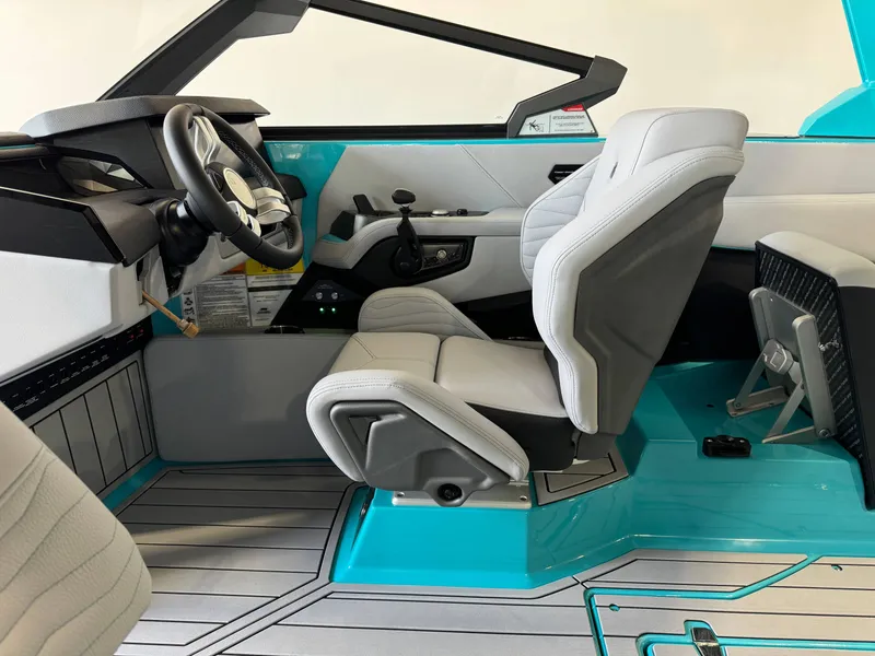 Slide: The Image of Interior of 2025 Nautique Super Air Nautique G25 boat with modern helm and seating. - 23