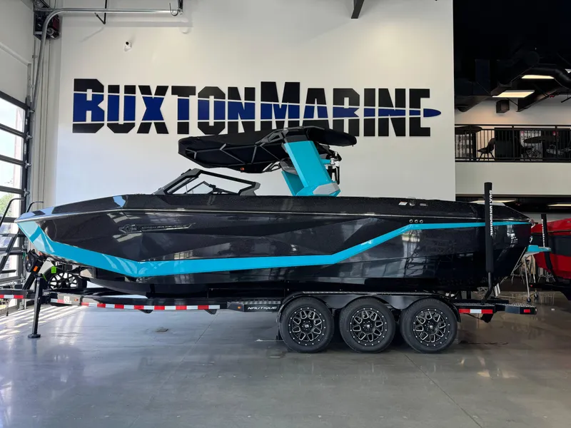 Slide: The Image of 2025 Nautique Super Air Nautique G25 boat on display at Buxton Marine showroom. - 4