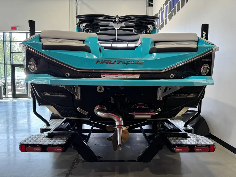 Slide: The Image of 2025 Nautique Super Air Nautique G25 boat rear view in showroom. - 6
