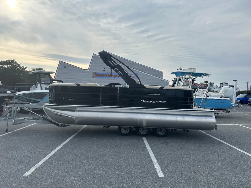 Slide: The Image of 2024 Berkshire 22RFX ARCH CTS 2.75 pontoon boat in a parking lot. - 0