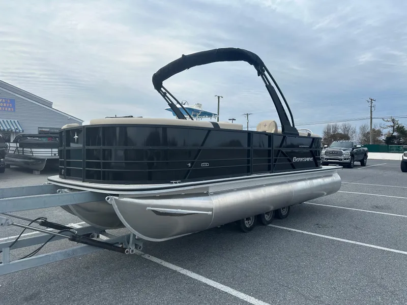 Slide: The Image of 2024 Berkshire 22RFX ARCH CTS 2.75 pontoon boat in a parking lot. - 1