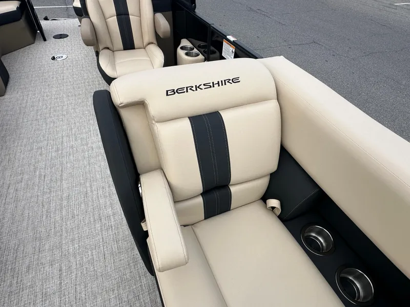Slide: The Image of 2024 Berkshire 22RFX ARCH CTS 2.75 boat interior with beige and black seating. - 10