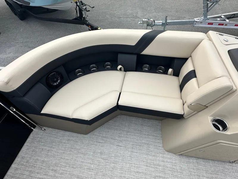 Slide: The Image of 2024 Berkshire 22RFX ARCH CTS 2.75 boat interior seating with beige and black upholstery. - 11