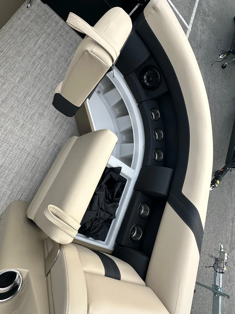 Slide: The Image of 2024 Berkshire 22RFX ARCH CTS 2.75 boat interior with beige and black seating. - 12