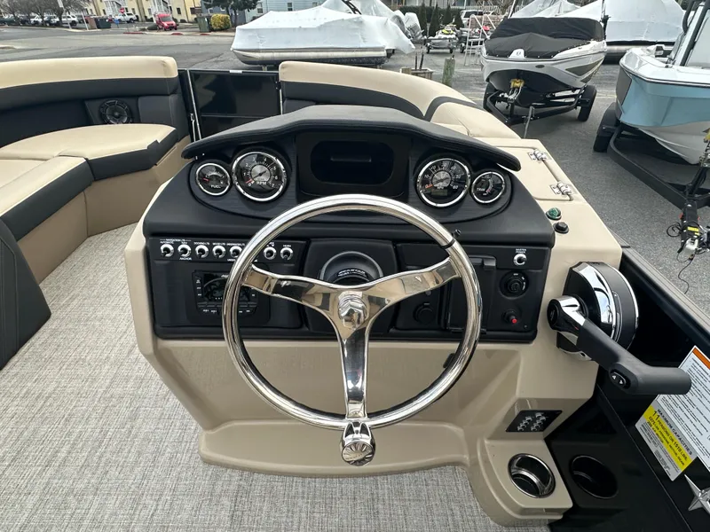 Slide: The Image of 2024 Berkshire 22RFX ARCH CTS 2.75 boat dashboard with steering wheel and control panel. - 15