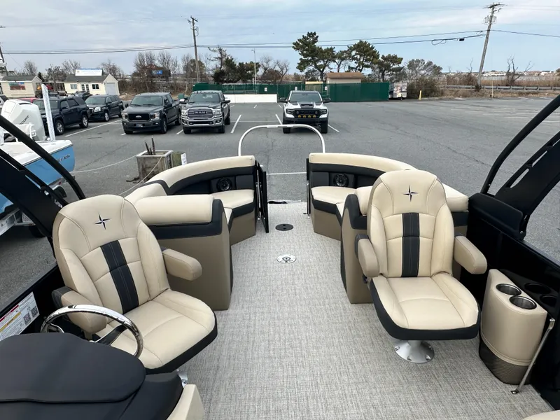 Slide: The Image of 2024 Berkshire 22RFX ARCH CTS 2.75 pontoon boat interior with beige and black seating. - 17