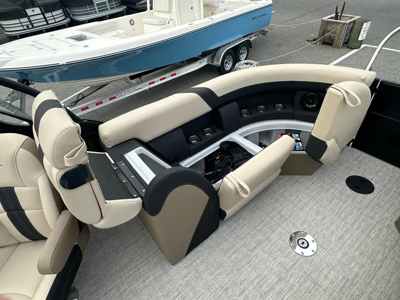 Slide: The Image of 2024 Berkshire 22RFX ARCH CTS 2.75 boat interior with beige and black seating. - 20