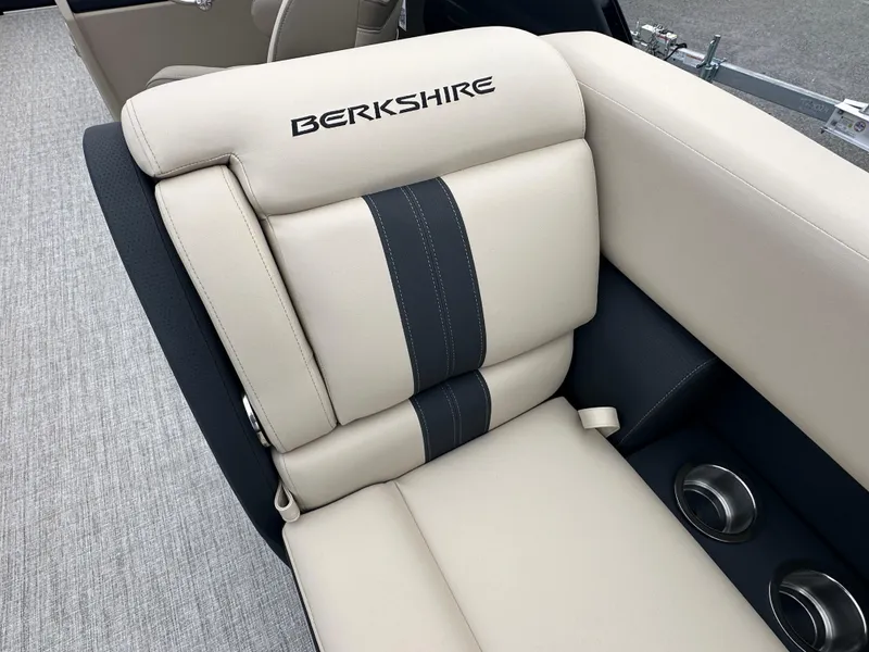 Slide: The Image of 2024 Berkshire 22RFX ARCH CTS 2.75 boat seat with beige and black upholstery. - 22