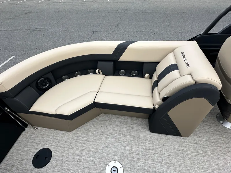 Slide: The Image of 2024 Berkshire 22RFX ARCH CTS 2.75 boat interior with beige and black seating. - 24