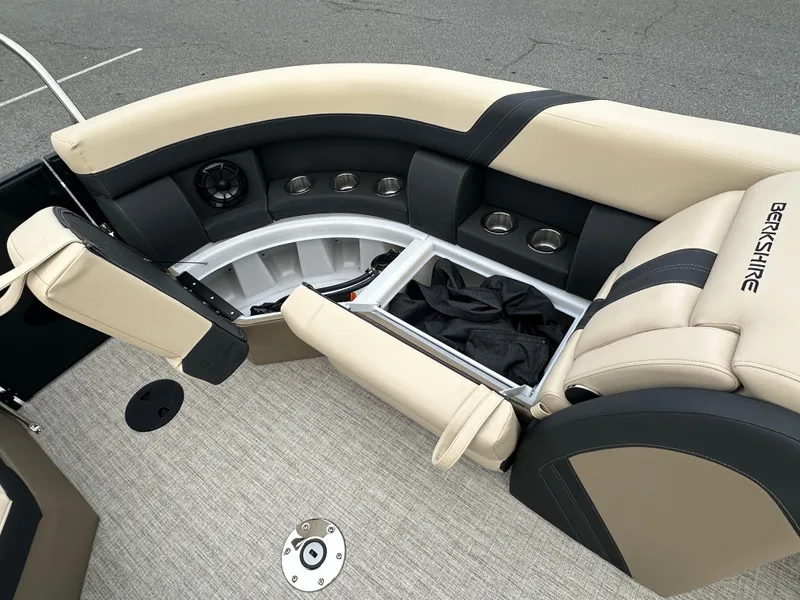 Slide: The Image of 2024 Berkshire 22RFX ARCH CTS 2.75 boat interior with beige seating and storage compartments. - 25