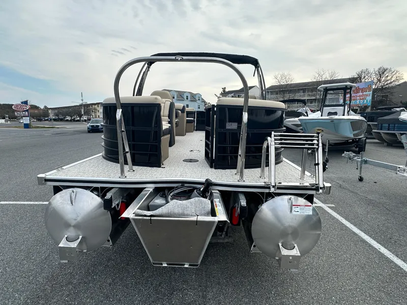 Slide: The Image of 2024 Berkshire 22RFX ARCH CTS 2.75 pontoon boat, rear view in a parking lot. - 28