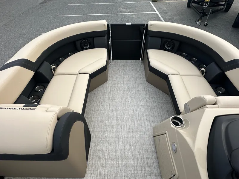 Slide: The Image of 2024 Berkshire 22RFX ARCH CTS 2.75 pontoon boat interior with beige and black seating. - 6