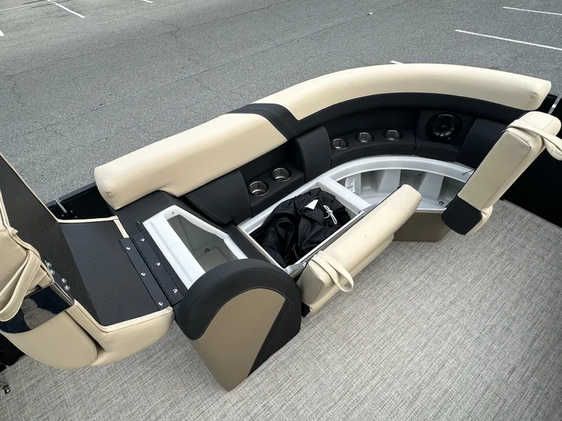 Slide: The Image of 2024 Berkshire 22RFX ARCH CTS 2.75 boat interior with beige and black seating. - 8