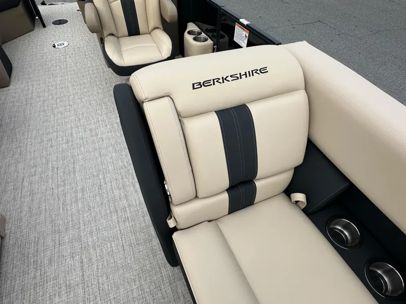 Slide: The Image of 2024 Berkshire 22RFX ARCH CTS 2.75 boat interior with beige and black seating. - 9