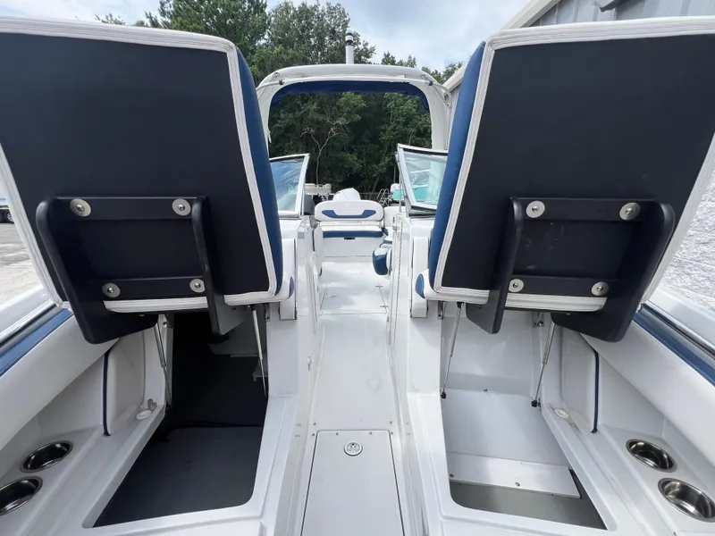 Slide: The Image of 2024 Crownline 270 XSS boat interior with dual seats and white deck. - 18